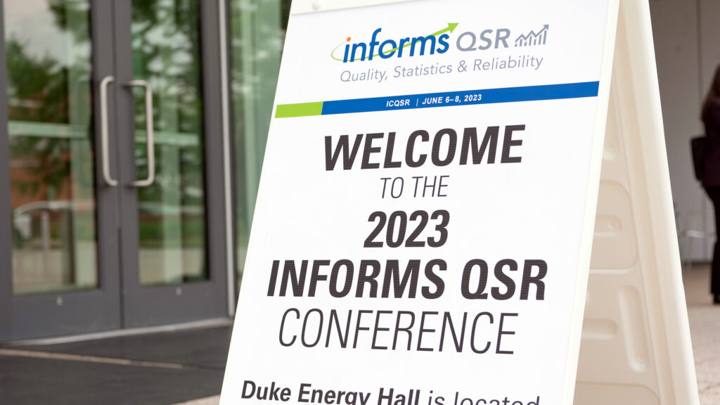 The Welcome to the 2023 INFORMS QSR Conference outside of the James B. Hunt Library on NC State's Centennial Campus